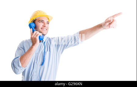 Visionary architect talking on phone and pointing finger up showing something Stock Photo