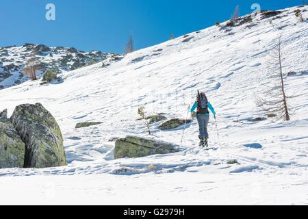 Skier walking on a trail. Stock Photo
