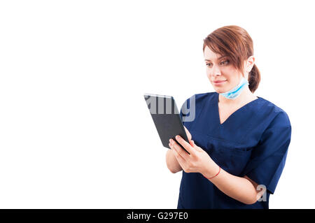Attractive woman doctor using wireless tablet on white copyspace Stock Photo