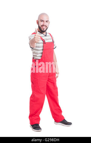 Plumber or mechanic showing like and thumb-up gesture smiling isolated on white Stock Photo