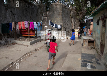 Mumbai, India. 26th May, 2016. Children play outside the abandoned Riwa Fort inside the slums of dharavi in Mumbai, India. Credit:  Chirag Wakaskar/Alamy Live News Stock Photo