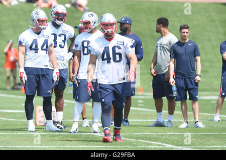 New England Patriots fullback James Develin, front, gets help with his  jersey during a combined NFL football training camp with the Tennessee  Titans Wednesday, Aug. 14, 2019, in Nashville, Tenn. (AP Photo/Mark