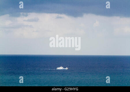 Beirut Lebanon. 27th May 2016. A white ship stands out against the blue waters crossing the  calm seas of the Mediterannean off the Lebanon coast Credit:  amer ghazzal/Alamy Live News Stock Photo