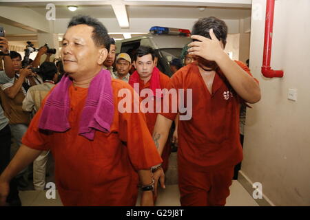 Phnom Penh, Cambodia. 27th May, 2016. Soth Vanny (front L), Chay Sarith (rear C), and Mao Hoeun (R) are escorted to the Phnom Penh Municipal Court to hear their verdict in Phnom Penh, Cambodia, May 27, 2016. A Cambodian court on Friday sentenced each of three men to four years in prison, with three years of that suspended, for assaulting two opposition lawmakers last year, according to a verdict pronounced by Presiding Judge Heng Sokna. Credit:  Phearum/Xinhua/Alamy Live News Stock Photo