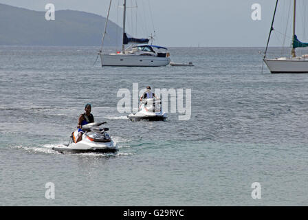 Two people riding on jet-skis, Fort De France, Martinique, Caribbean Stock Photo