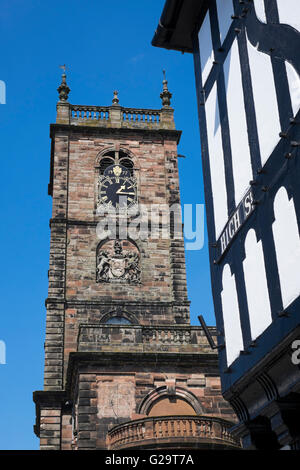 St Alkmund's Church and a half-timbered building in High Street,Whitchurch, North Shropshire, England, UK Stock Photo