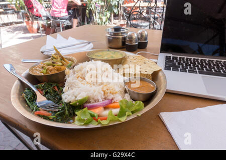 Traditional meal of dal bhat on a table in a restaurant, Kathmandu, Nepal Stock Photo