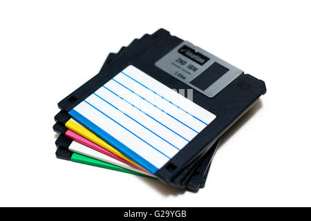 Stack of 3.5" floppy discs on a white background. Stock Photo