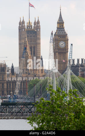 View of the Houses of Parliament with Hungerford Bridge and Big Ben Stock Photo