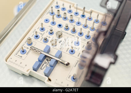 Plastic case a set of drill bits with color-coded health. Tools for dental prosthetist Stock Photo