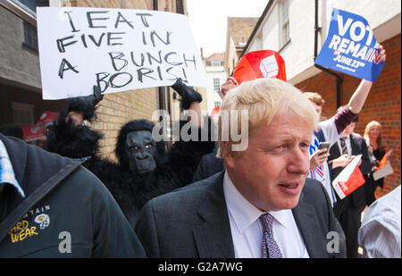 Boris Johnson is followed by activists for the Vote Remain campaign, following a Vote Leave campaign event in Winchester, as part of his tour on the Vote Leave campaign bus. Stock Photo