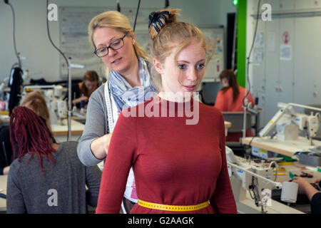 Fitting during the practical training for tailors Stock Photo