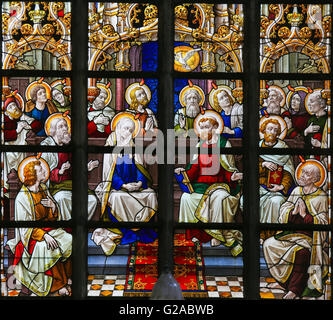 LIER, BELGIUM - MAY 16, 2015: Stained Glass window in St Gummarus Church in Lier, Belgium, depicting the gathering of Mary and t Stock Photo