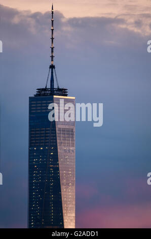 One World Trade Center against dramatic sky at dusk Stock Photo