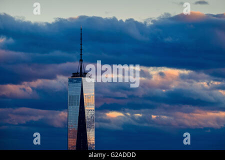 One World Trade Center against dramatic sky at dusk Stock Photo