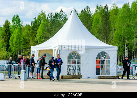 Emmaboda, Sweden - May 14, 2016: Forest and tractor (Skog och traktor) fair. People arriving at the entrance. A party tent works Stock Photo