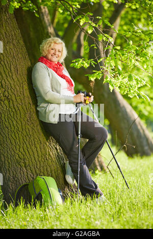 happy senior hiking in the forest park Stock Photo - Alamy