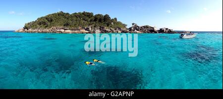 Couple snorkeling in crystal water at similan island, Andaman sea,Phuket, Thailand Stock Photo