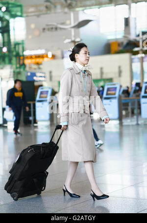 Incheon, South Korea - February 15, 2016: Asian Korean female air flight hostess at Incheon International airport. Stock Photo