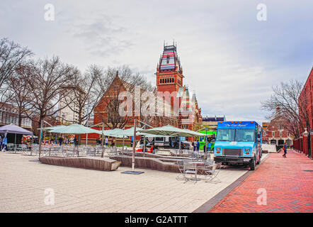 Cambridge, USA - April 29, 2015: Memorial Hall and tourists in Harvard University in Cambridge, Massachusetts, USA. Stock Photo