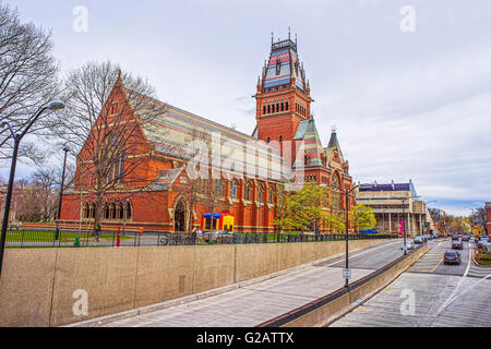 Street view on Memorial Hall and tourists in Harvard University in Cambridge, Massachusetts, USA. It was built in honor of men who died during the American Civil War. Stock Photo