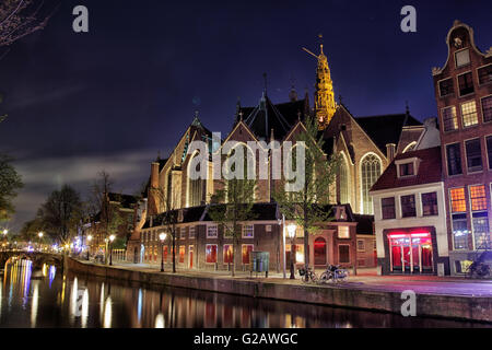 Night shot of the Oude Kerk, the oldest remaining building in Amsterdam, Netherlands, Europe. Stock Photo