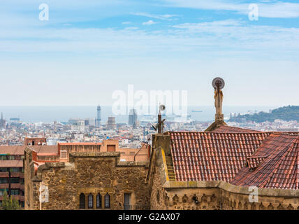 Buildings roofs in Barcelona, Spain. Cityscape and the sea as a background Stock Photo