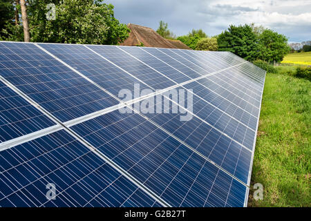 Kent, UK. An array of solar panels (PV or photo-voltaic) installed on a farm Stock Photo