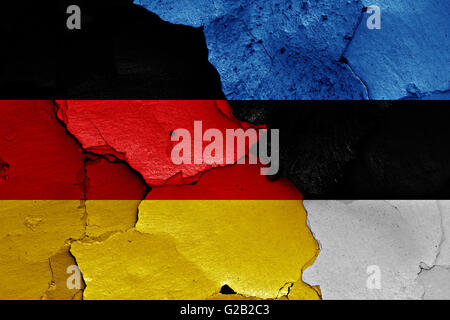 flags of Germany and Estonia painted on cracked wall Stock Photo