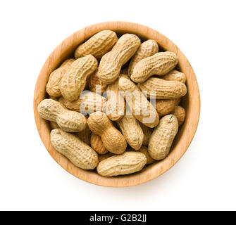 Dried peanuts in wooden bowl isolated on white background. Stock Photo