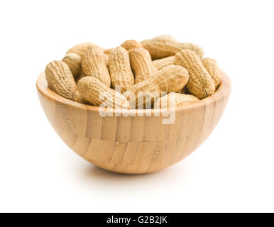 Dried peanuts in wooden bowl isolated on white background. Stock Photo