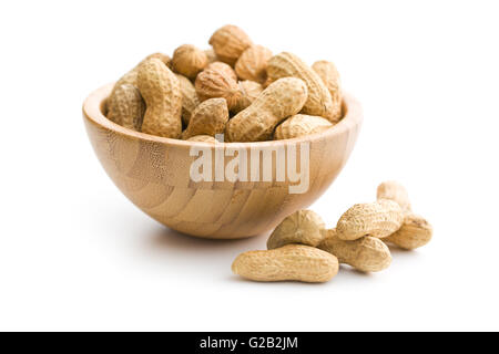 Dried peanuts in wooden bowl isolated on white background. Stock Photo