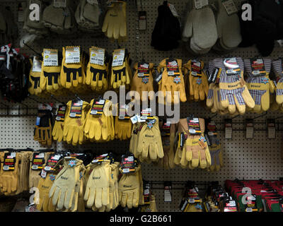 Display of work gloves in a Massachusetts hardware and garden store. Stock Photo