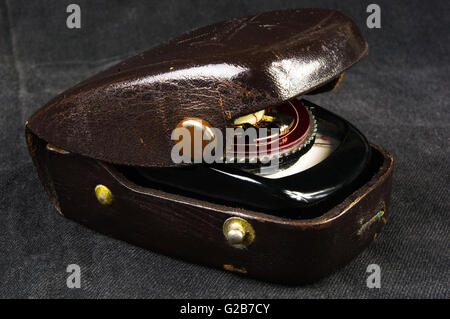 old vintage Soviet exposure meter with leather case on black background Stock Photo