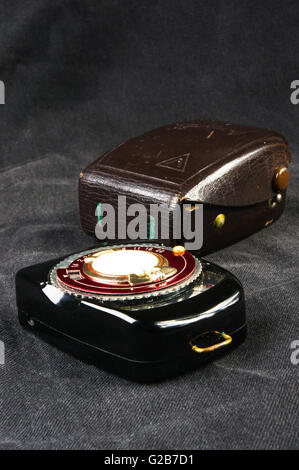 old vintage Soviet exposure meter with leather case on black background Stock Photo