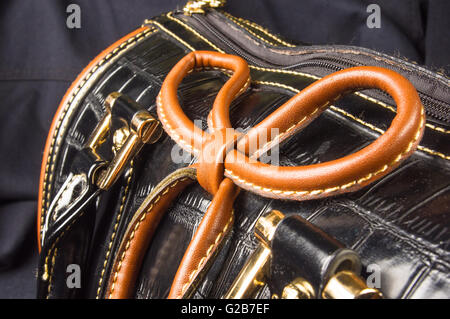 closeup of the fittings on the black leather hand bag Stock Photo