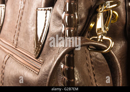 closeup of the fittings on the brown leather hand bag Stock Photo