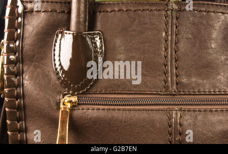 closeup of the fittings on the brown leather hand bag Stock Photo