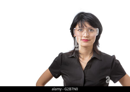 young attractive female wears protective glasses, studio shot isolated on white background Stock Photo