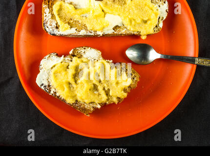 the bachelor dinner - toast with butter and yellow caviar Stock Photo