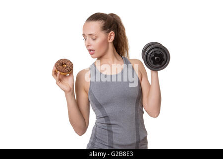 single woman trying to work out if she should be healthy Stock Photo