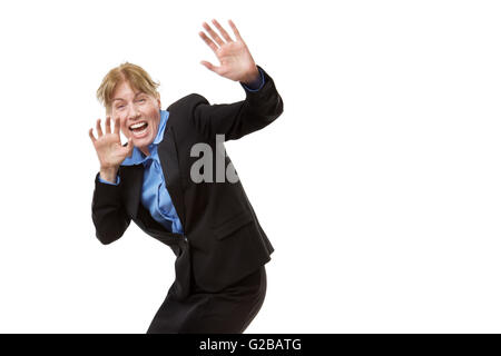 Studio shot of a Scared business woman defending herself with her arms up in the air Stock Photo