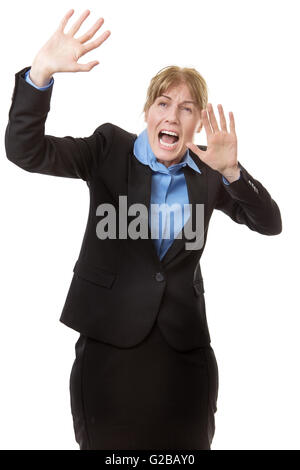 Studio shot of a Scared business woman defending herself with her arms up in the air Stock Photo