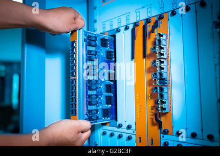 People fix core switch in network room . Stock Photo