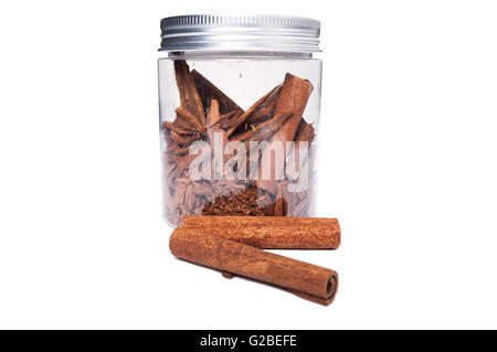 Cinnamon sticks in transparent plastic jar as kitchen storage container presentation Stock Photo