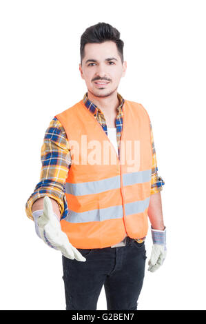 Handsome young engineer or constructor extending hand to shake as successful partnership or deal concept isolated on white Stock Photo