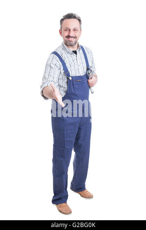 Handsome repairman or mechanic ready to handshake as greeting or welcoming concept isolated on white background Stock Photo
