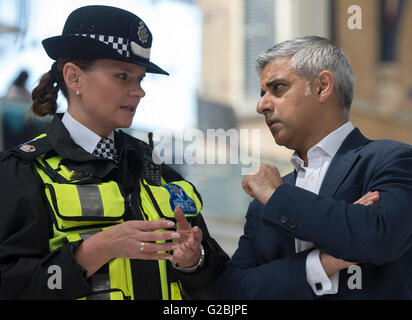 Mayor of London Sadiq Khan talks to British Transport Police Superintendent Gill Murray during a routine operation with the BTP at Liverpool Street station in London, as he announced that former Metropolitan Police Authority chairman Lord Harris is to lead a review into how ready London is to tackle a major terror attack. Stock Photo