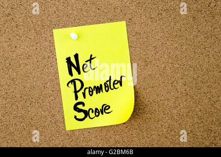 Business Acronym NPS Net Promoter Score written on yellow paper note pinned on cork board with white thumbtack Stock Photo
