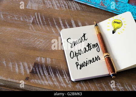 Handwritten text Smart Operating Business with fountain pen on notebook. Concept image with copy space available. Stock Photo